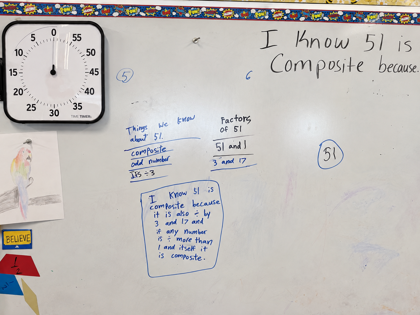 A classroom whiteboard showing student-generated factor reasoning and a written proof that 51 is composite